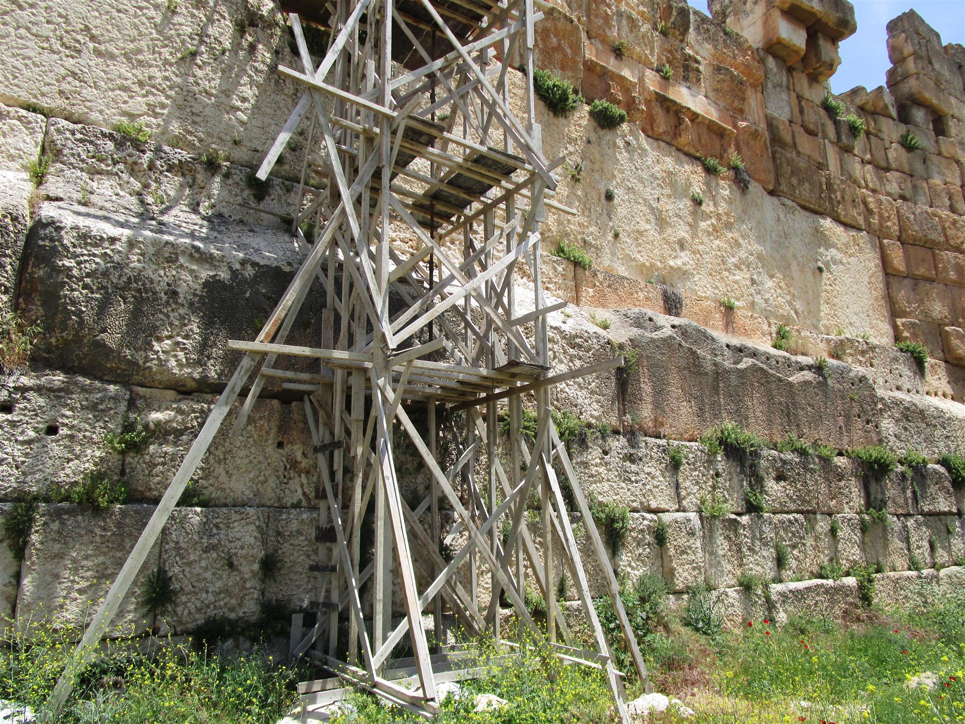 The western retaining wall of the Temple of Jupiter podium at Baalbek, Lebanon, showing the three massive limestone blocks of the Trilithon