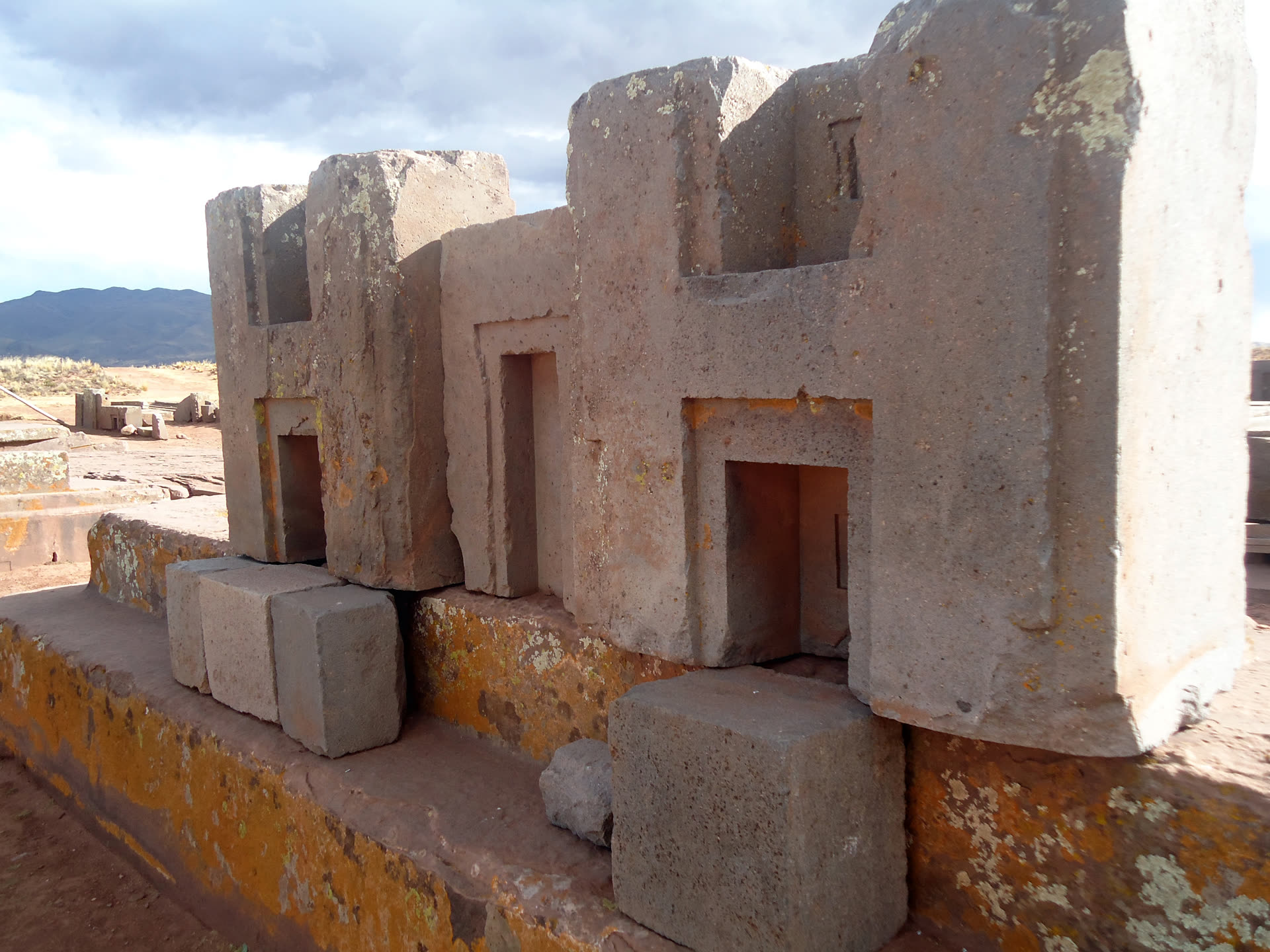 Precisely cut, interlocking H-shaped andesite and sandstone blocks at Puma Punku, part of the Tiwanaku archaeological complex, Bolivia