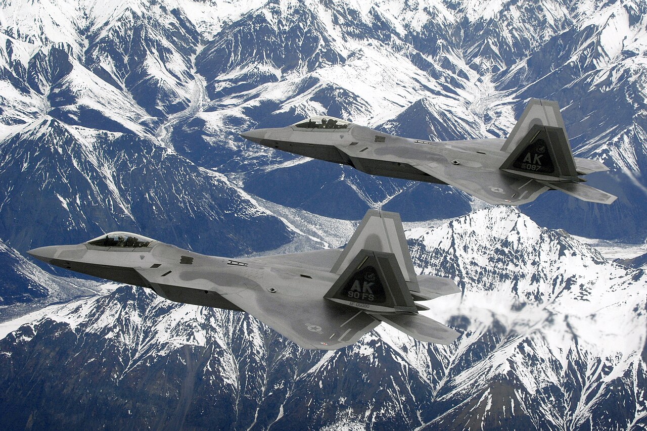 A pair of U.S. Air Force F-22 Raptors flying over Alaska, the same aircraft type and unit that shot down the unidentified object on February 10, 2023