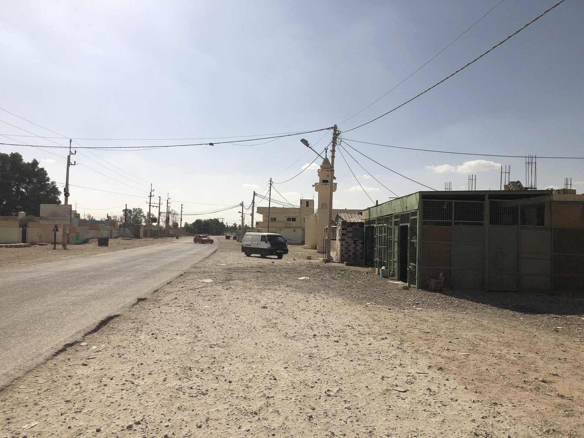 A road through the desert town of Al-Jafr, Ma'an Governorate, Jordan