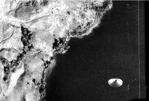 Black-and-white aerial survey photograph of Lago Cote, Costa Rica, showing a metallic disc-shaped object over the water, taken September 4, 1971