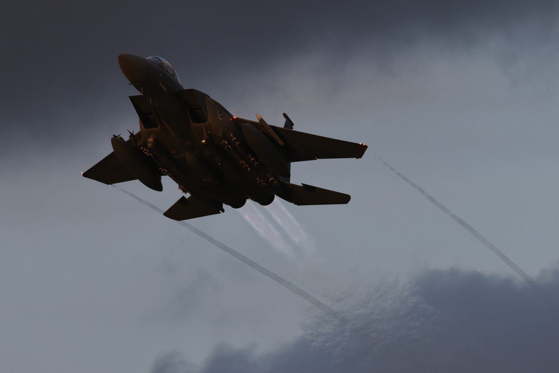 An F-15E Strike Eagle of the 492nd Fighter Squadron flying over RAF Lakenheath, England