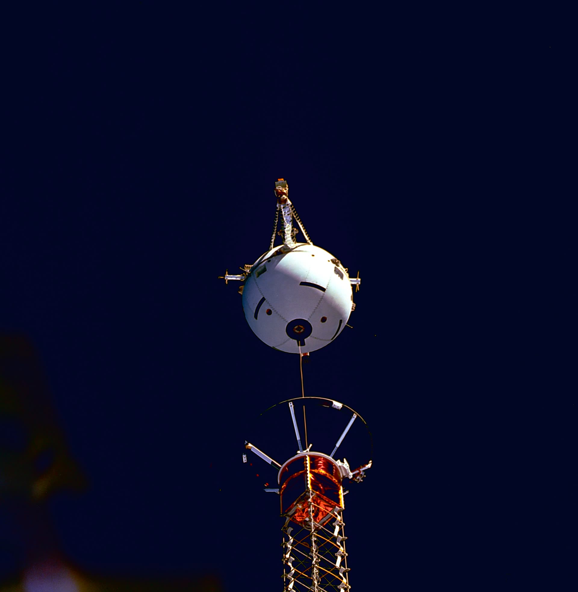 NASA photograph STS075-701-087 of the Tethered Satellite System (TSS-1R) atop its deployment boom in Columbia's payload bay, February 25, 1996