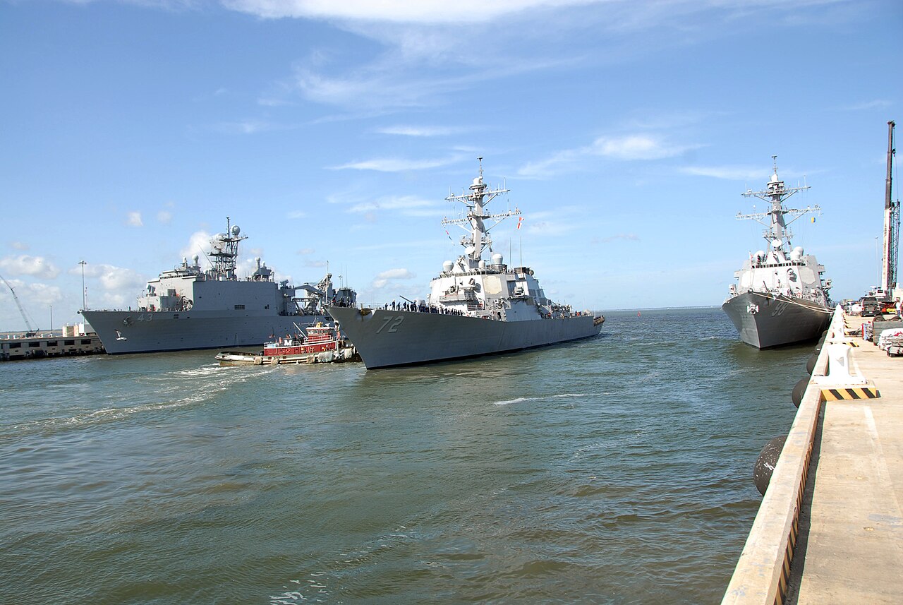 A U.S. Navy Arleigh Burke-class guided-missile destroyer departing Naval Station Norfolk, Virginia, the same class of vessel operated by the fleet based near where the AARO-documented UAP/USV swarm occurred